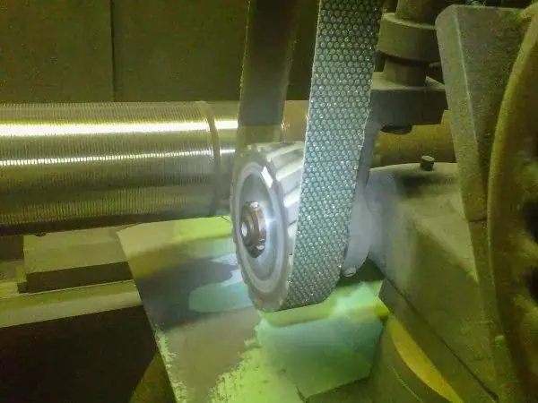Steel roll grinding